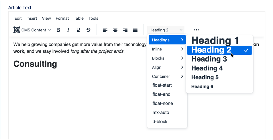 Formatting dropdown open with Headings submenu expanded and Heading 2 checked, Consulting typed below as a heading